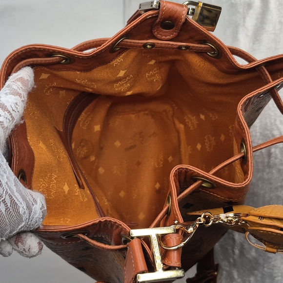 MCM Cognac Leather Drawstring Shoulder Crossbody Bucket Bag with Charm - Picture 11 of 17